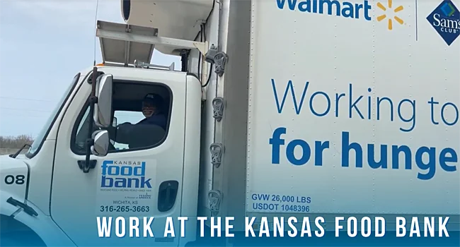 Driver in truck with words 'Work at the Kansas Food Bank'