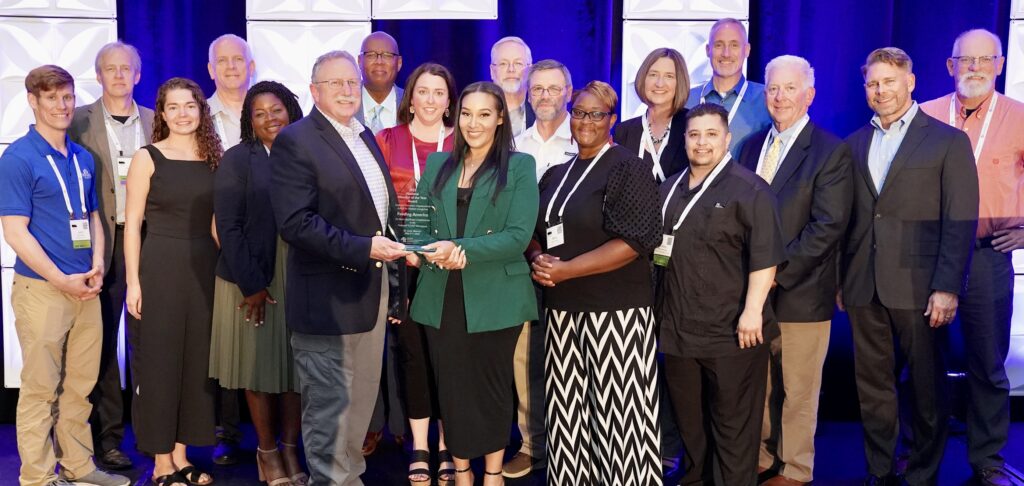 Feeding America food bank members are presented with the National VOAD Member of the Year Award at the 2023 National VOAD Conference. 